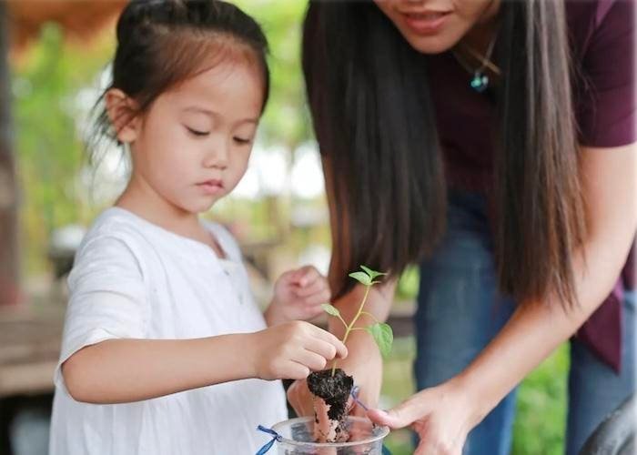 child-in-nature-focused-activity-with-parent